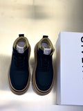 Dark navy lace-up sneakers with beige soles and side stitching detail