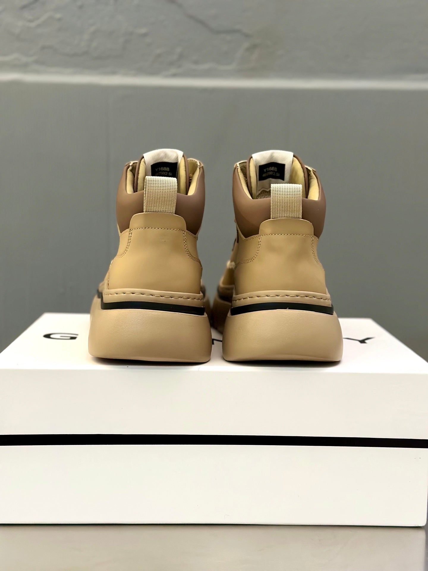 Beige leather sneakers from heel, padded ankle collar and chunky rubber sole
