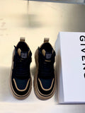 Black and beige lace-up sneakers with chunky sole and side stripe detail.