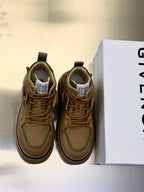 Olive-brown suede sneakers with lace-up front, padded collar, and chunky rubber sole.