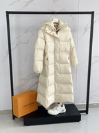 Moncler long puffer coat, cream, front view with snap placket and hood