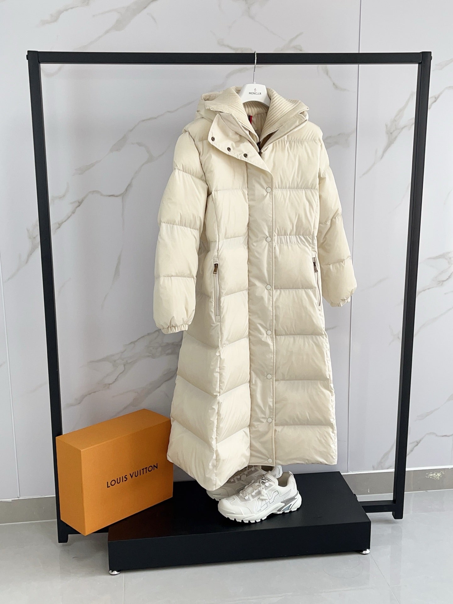 Moncler long puffer coat, cream, front view with snap placket and hood