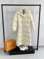 Moncler long puffer coat, cream, front view with chest pockets and hood