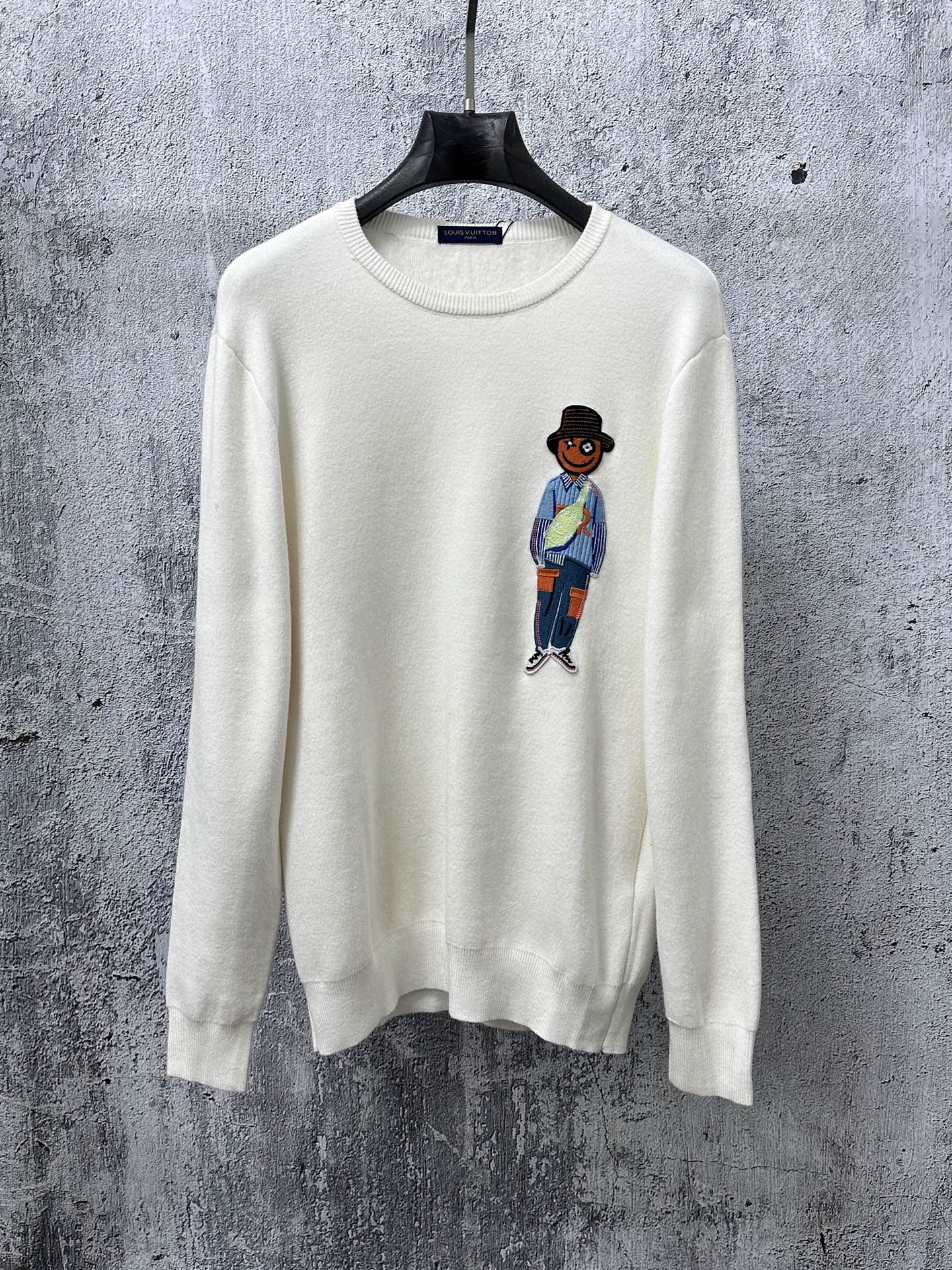 Louis Vuitton crewneck sweater, white knit with cartoon character graphic on chest