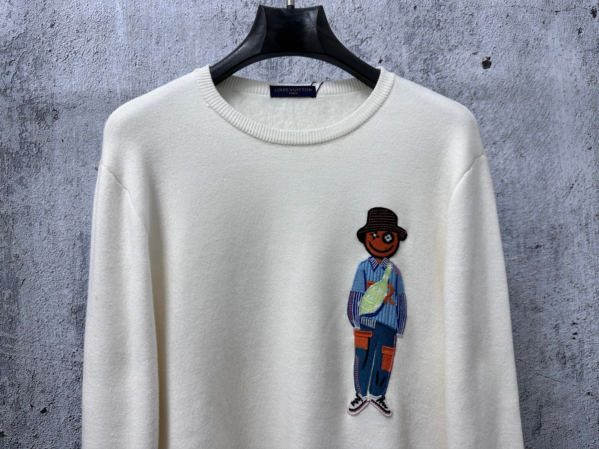 Louis Vuitton crewneck sweater, white knit with cartoon character graphic at center