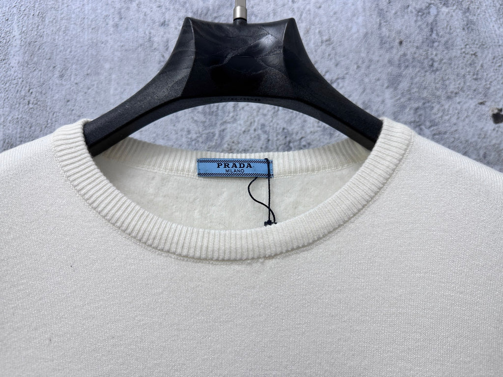 Prada cream sweater neckline with ribbed crewneck collar and PRADA label