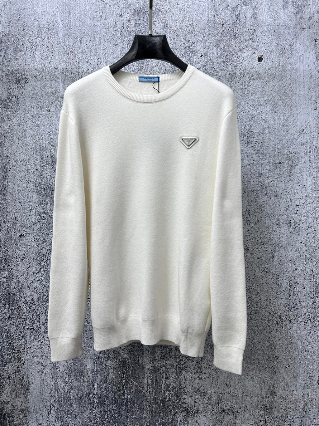Prada cream long-sleeve sweater with crewneck and small triangle logo on chest