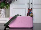 Louis Vuitton pink shoulder bag with green strap and diagonal seam detail