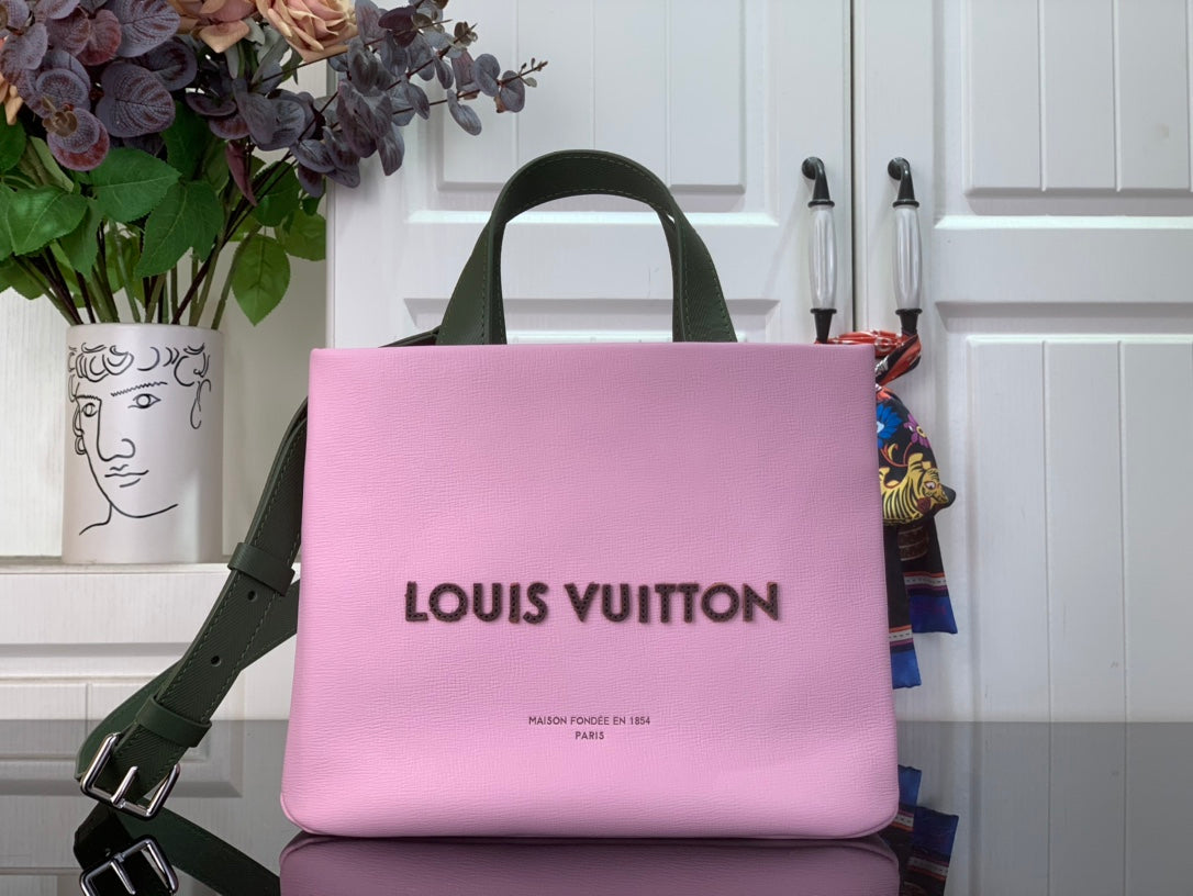 Louis Vuitton pink handbag with green handles and front logo print