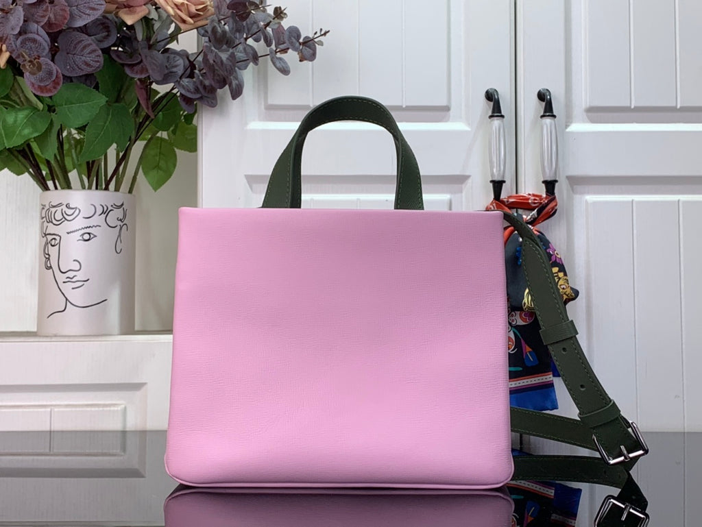 Louis Vuitton pink handbag with green strap and smooth front panel