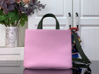 Louis Vuitton pink handbag with green strap and smooth front panel