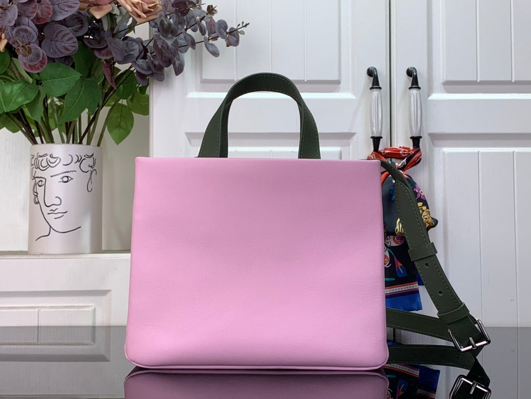 Louis Vuitton pink handbag with green strap and smooth front panel