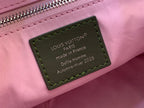 Louis Vuitton authenticity label on pink leather bag with green-stitched border
