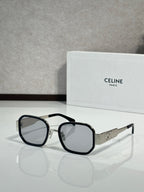 Sunglasses with black frames, clear lenses, and silver logo temples