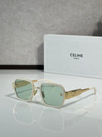Square gold sunglasses with pale green lenses and gold logo on the temples