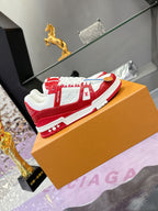 Louis Vuitton red-and-white low-top sneakers with LV logos and white lace-up front