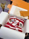 Louis Vuitton low-top sneakers with red leather, white laces, and red/white accents