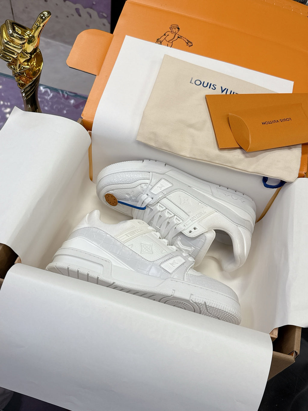 Louis Vuitton women's white lace sneakers, embossed logo and blue lace tag