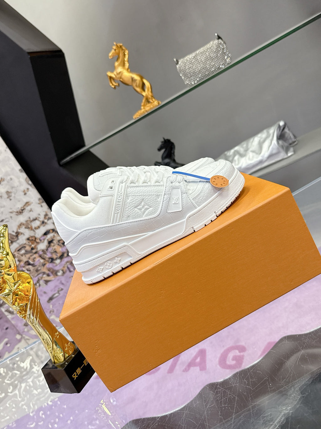 Louis Vuitton women's white lace sneakers, embossed upper and blue lace tie
