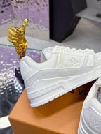 Louis Vuitton women's white lace sneakers, toe and side panel close-up
