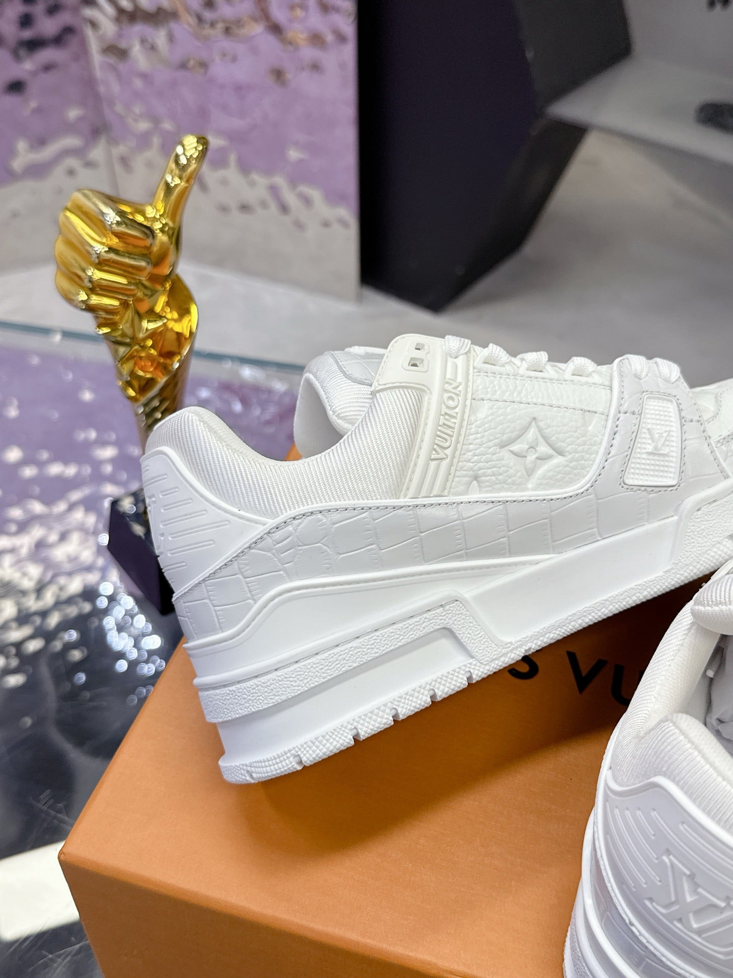 Louis Vuitton women's white lace sneakers, toe and side panel close-up
