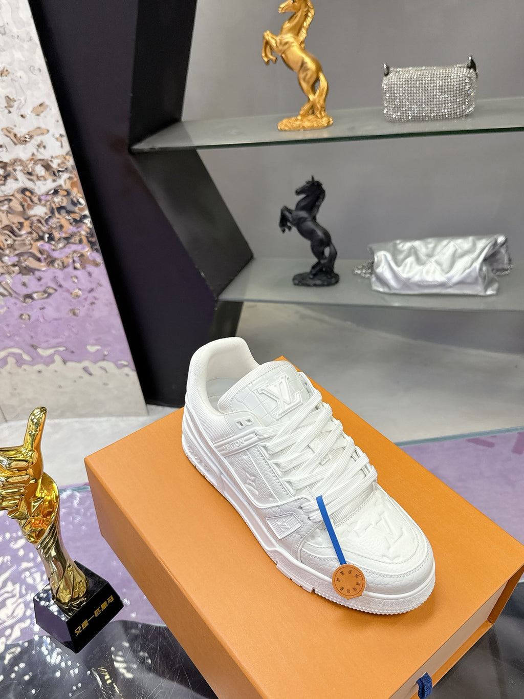 Louis Vuitton women's white lace sneakers, embossed upper on orange box