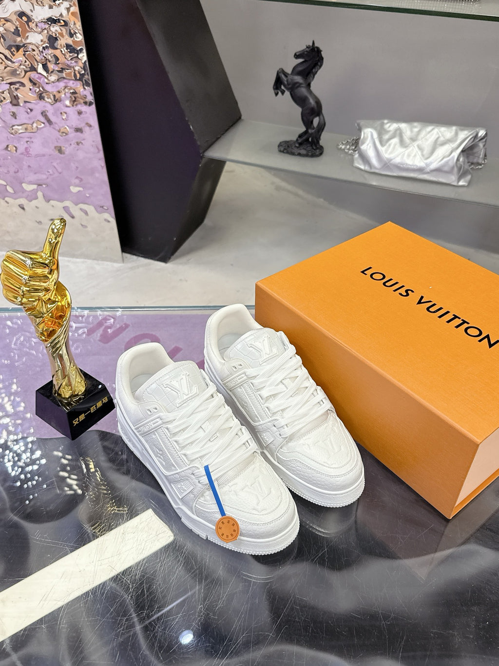 Louis Vuitton women's white lace sneakers, embossed panels and blue lace tab