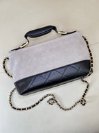 Chanel flap shoulder bag with light gray top and dark navy quilted lower band, chain strap