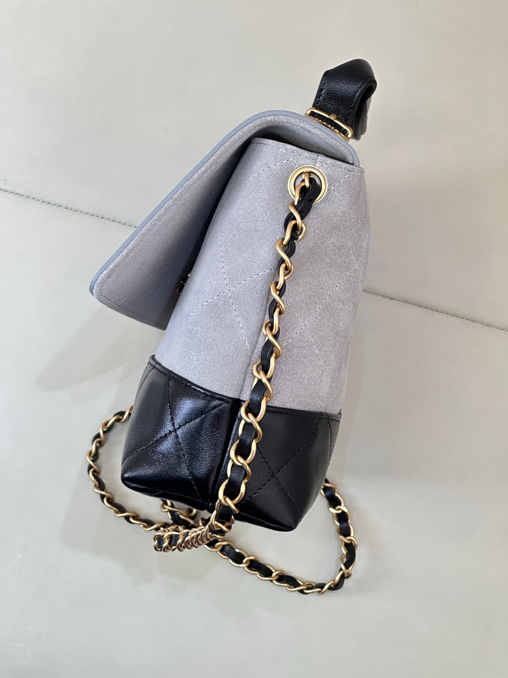 Chanel small shoulder bag, light gray upper and dark navy bottom with quilted panel