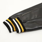 Black leather-look sleeve with ribbed yellow/white striped cuff trim