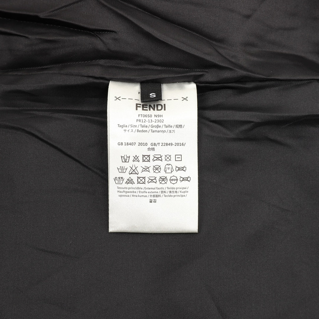 Black varsity jacket interior with FENDI size and care label tag