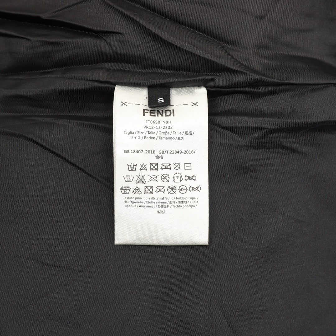 Black varsity jacket interior with FENDI size and care label tag