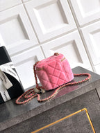Pink quilted mini bag with gold-tone hardware and braided chain strap