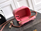 Pink mini bag open view with red lining and gold-tone zipper on chain strap