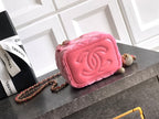 Pink mini crossbody bag with embossed CC logo and gold-tone chain strap