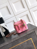 Pink quilted mini bag with gold-tone chain strap and top zipper closure