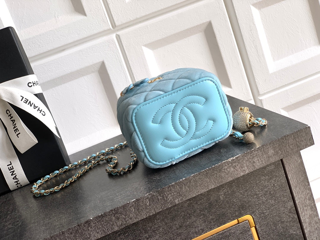 Chanel light blue quilted mini bag with embossed CC flap, chain strap, and zipper