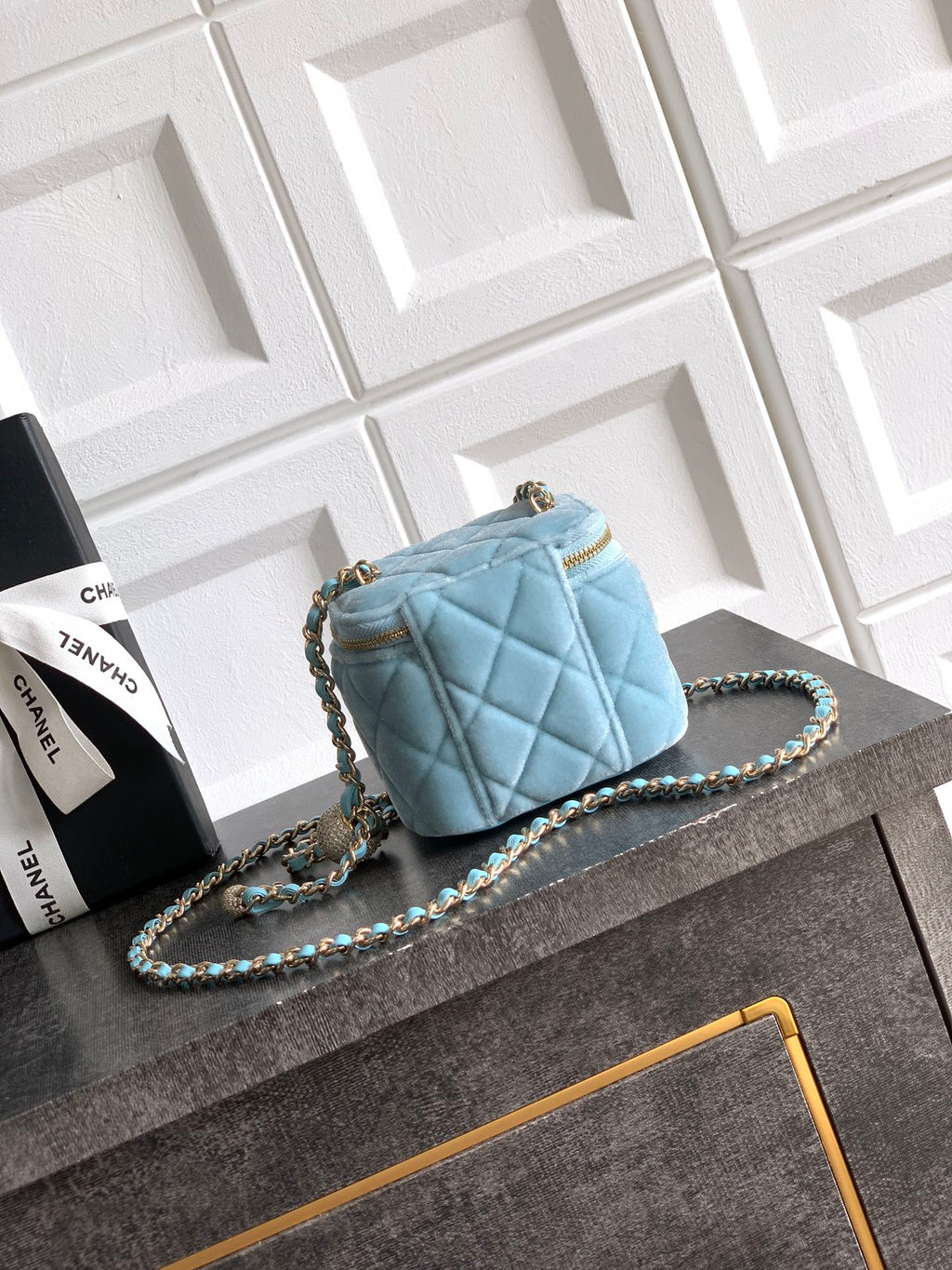 Chanel light blue quilted mini shoulder bag with chain strap and gold turnlock detail