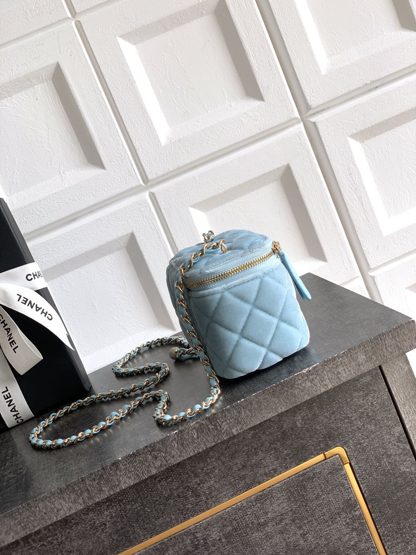 Chanel light blue quilted mini shoulder bag with chain strap and top zipper
