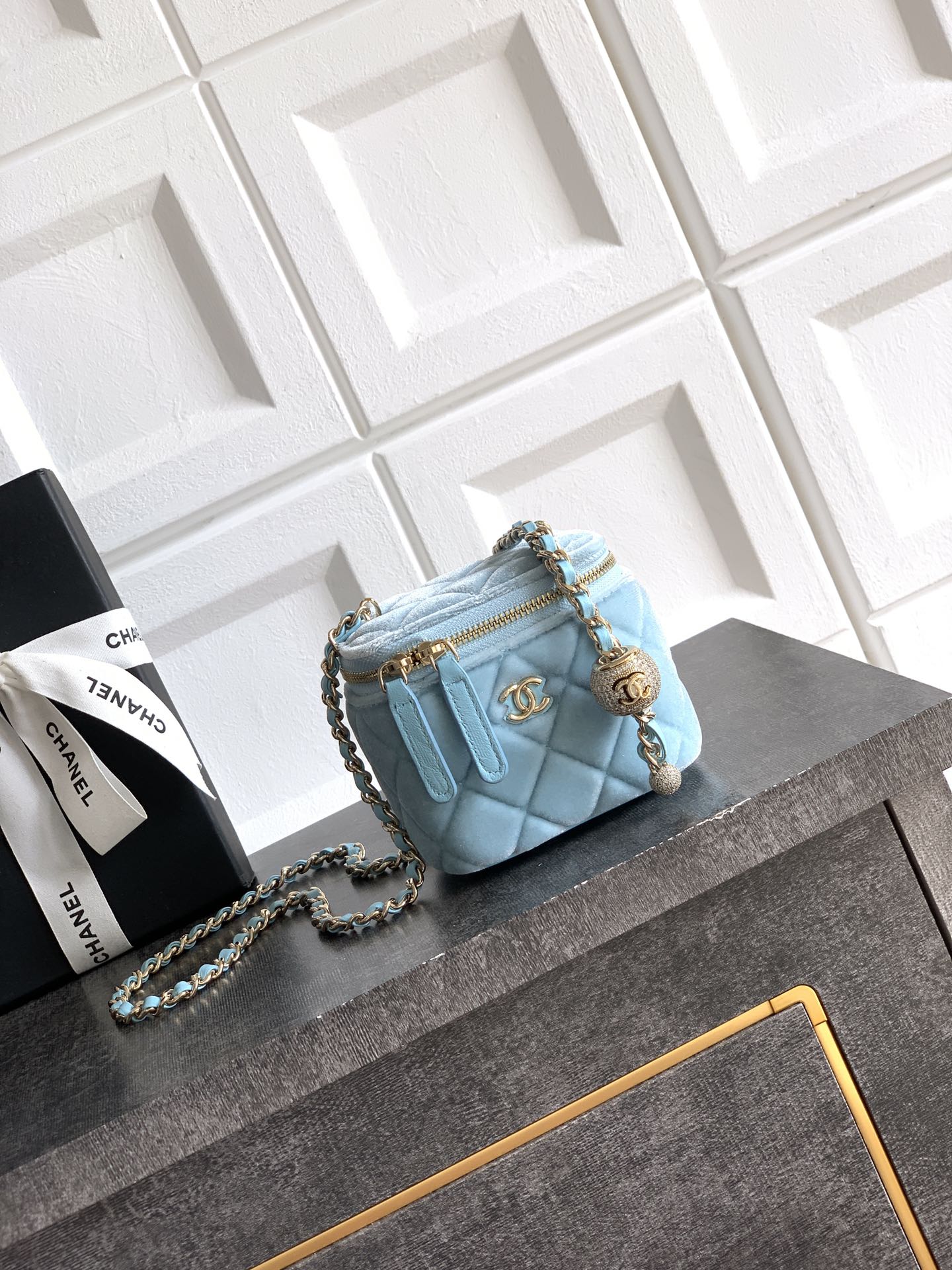 Chanel small light blue quilted shoulder bag with braided chain strap and gold hardware