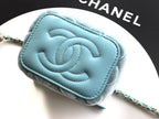 Chanel light blue quilted mini bag close-up showing embossed CC logo on front