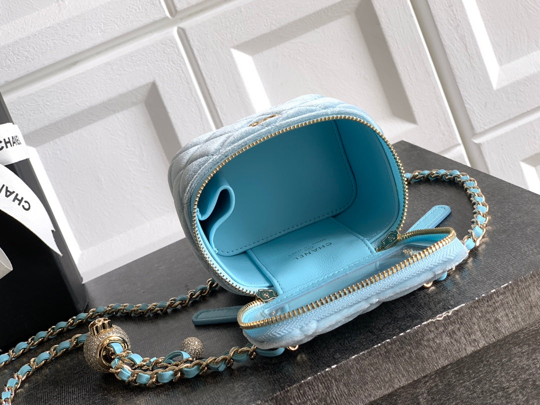 Chanel light blue mini shoulder bag open view with interior pocket and chain strap