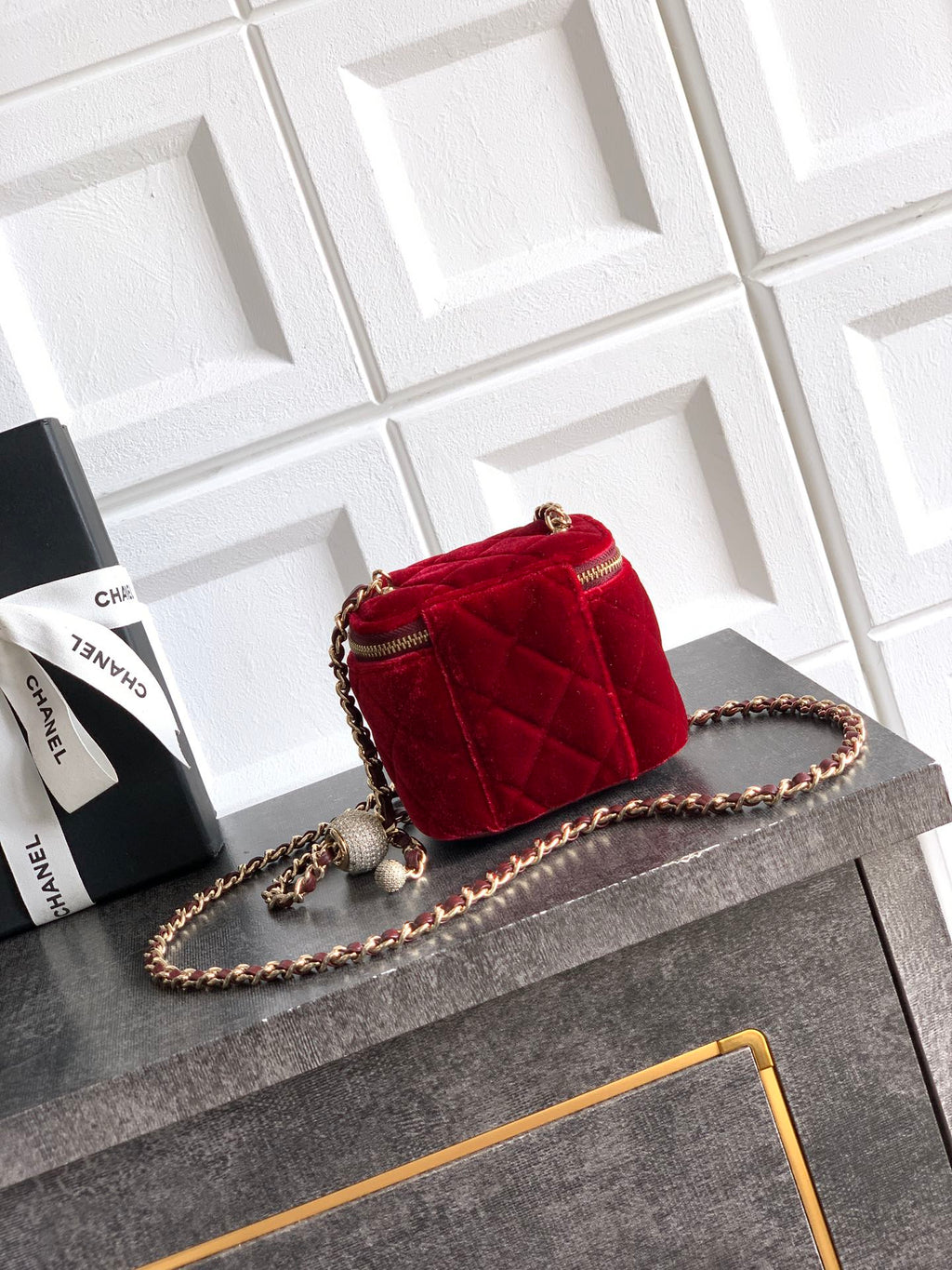 Red quilted Chanel mini shoulder bag with gold chain strap and top zip