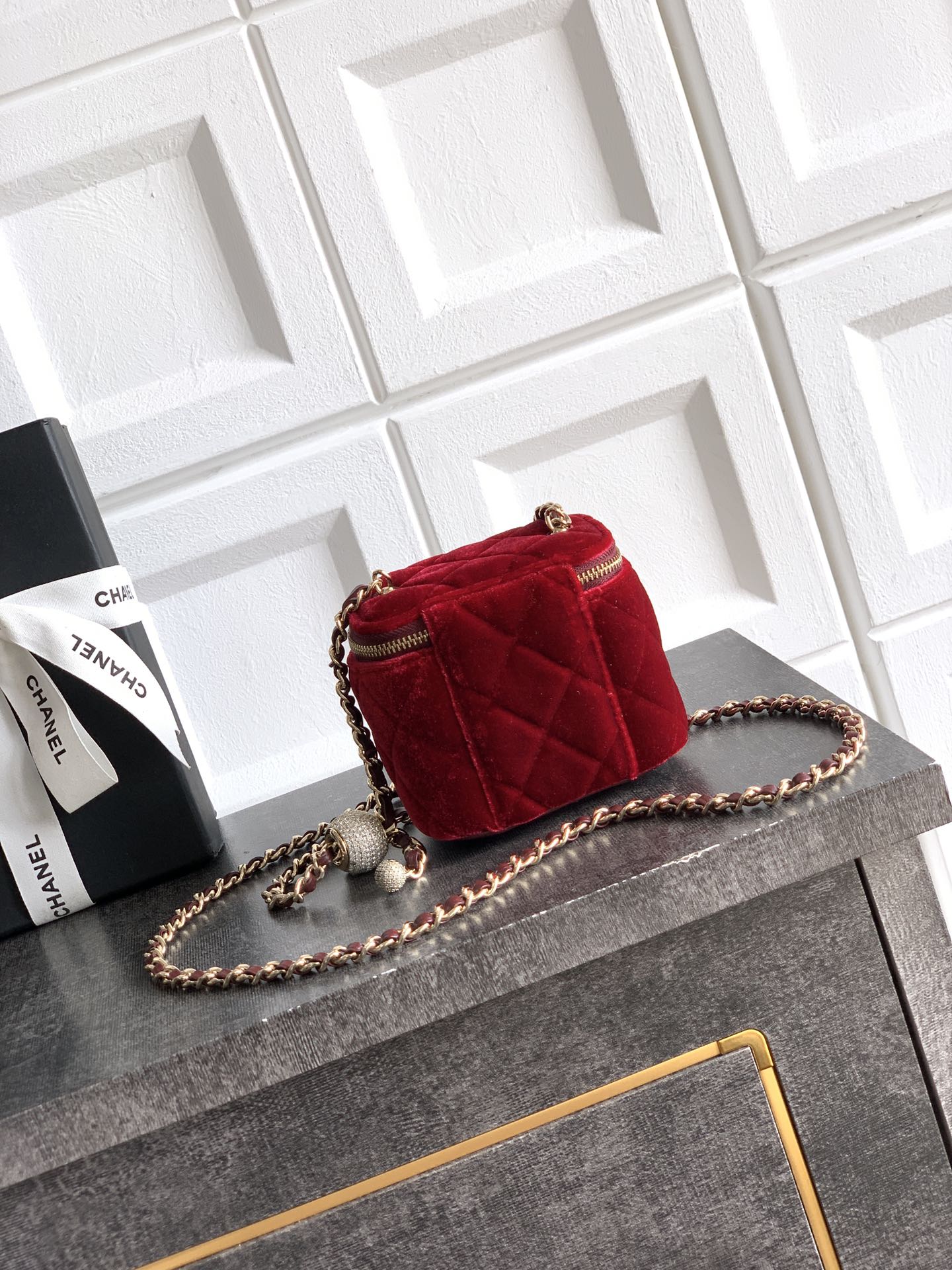Red quilted Chanel mini shoulder bag with gold chain strap and top zip