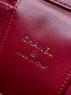 Red Chanel bag interior label with CHANEL and MADE IN ITALY text