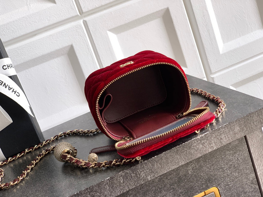 Red quilted Chanel mini bag with chain strap, open top view, and brown interior