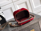 Red quilted Chanel mini bag with chain strap, open top view, and brown interior