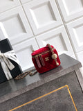 Red quilted mini Chanel bag with gold chain strap and top zip closure