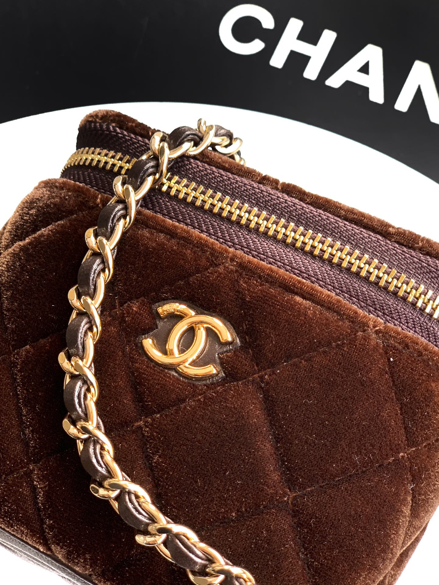 Brown velour crossbody bag with gold zip, CC emblem and chain strap detail