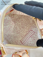 Louis Vuitton bag interior with beige patterned lining and zipper pocket